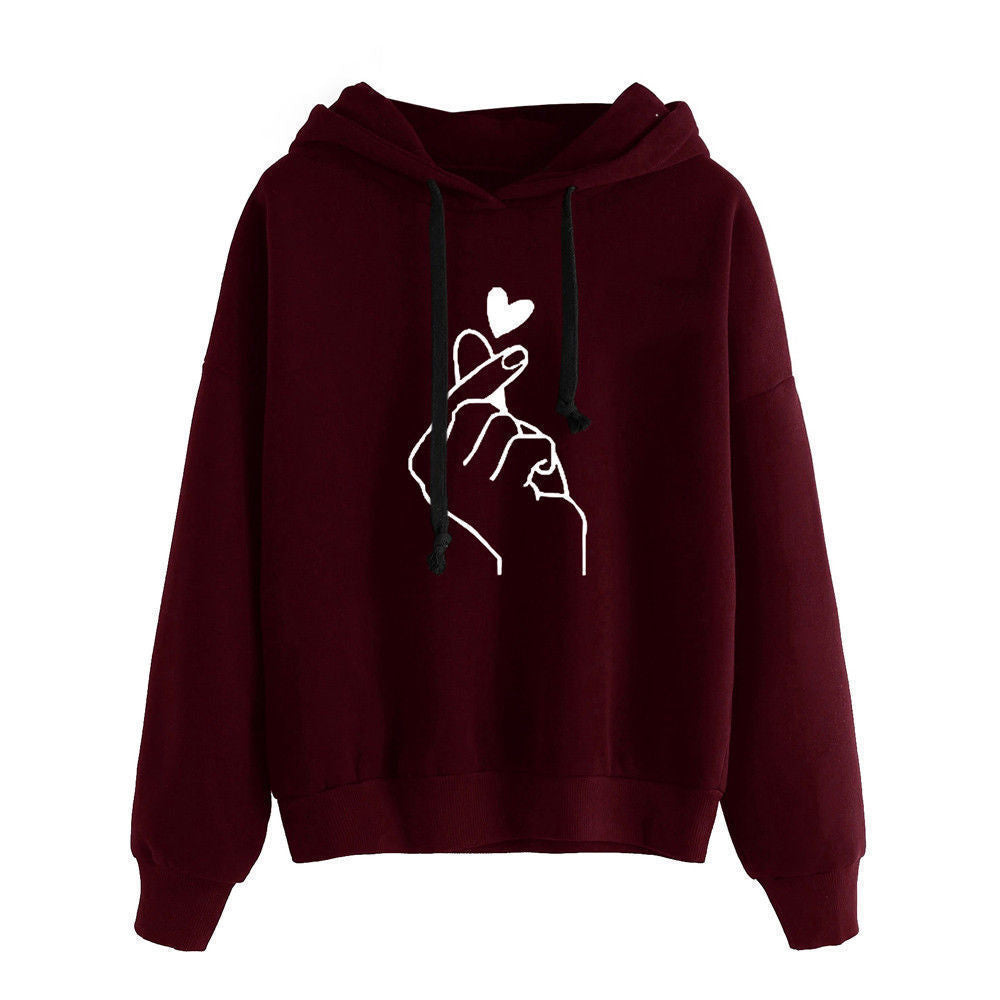 Fleece Hoodie with heart print design, burgundy color, featuring a stylish hand gesture graphic.