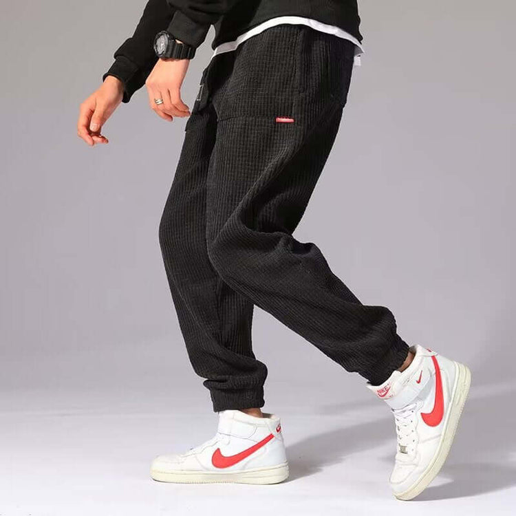 Mens Casual Pants worn with white Nike sneakers, showcasing style and comfort in a versatile outfit.