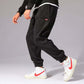 Mens Casual Pants worn with white Nike sneakers, showcasing style and comfort in a versatile outfit.