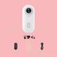4K Thumb Camera – Ultra Compact shown with accessories on pink background.