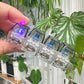 Clickie Keychain with LED lights, showcasing a hand holding the stylish key organizer.