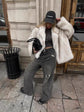Fluffy Fox Fur Coat Women Loose Elegant Winter worn by a stylish woman with a cap, paired with grey jeans in urban setting.