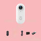 4K Thumb Camera – Ultra Compact with accessories on pink background