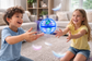 Two children happily playing with a Flying Ball in a cozy living room, enjoying interactive fun.