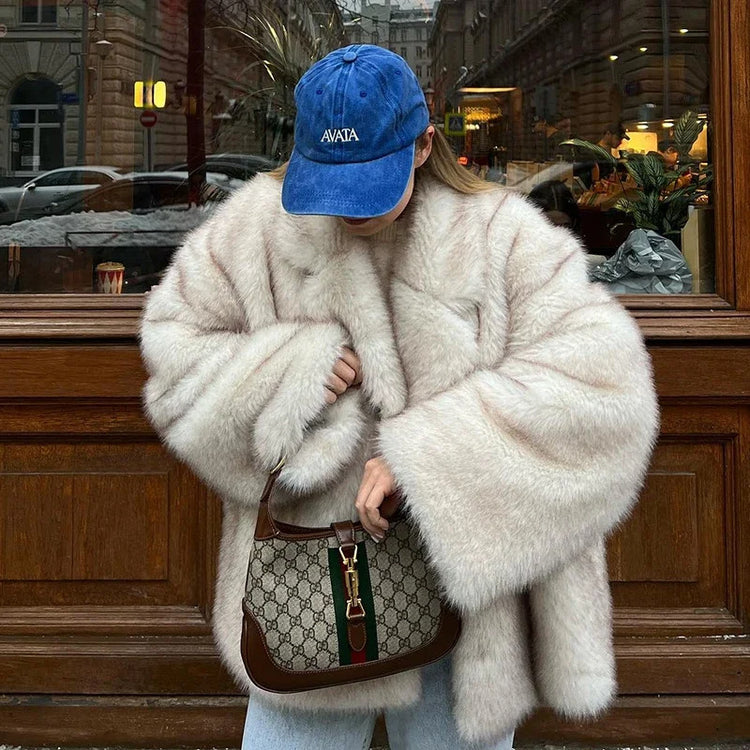 Fluffy Fox Fur Coat Women Loose Elegant Winter worn by a woman with a blue cap and Gucci handbag in a city setting.