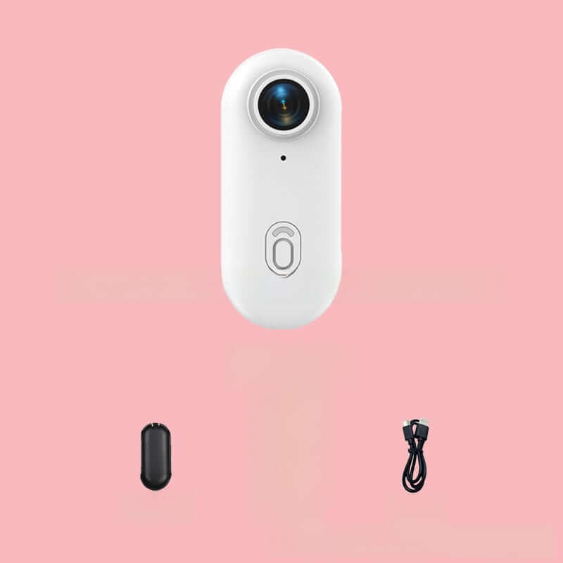 4K Thumb Camera – Ultra Compact in white with charging cable and accessory on a pink background.
