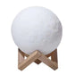Rechargeable Moon Night Light with Touch Control on a wooden stand, designed for illuminating dark spaces.
